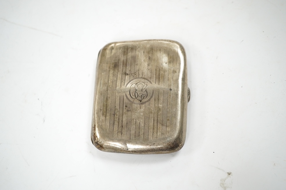 Three assorted silver cigarette cases, largest 11.7cm, a pair of small silver dishes and two silver sauceboats, gross 24.5oz. Condition - poor to fair